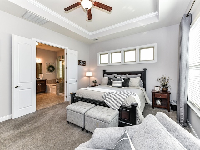 2005 Arbor Hills Dr, Indian Trail, NC 28079 - carpeted bedroom featuring a tray ceiling, crown molding, connected bathroom, and ceiling fan