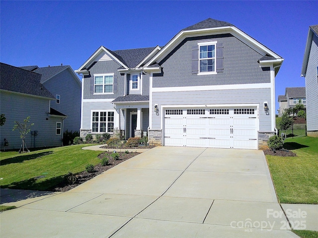 1141 Overlake Dr, Belmont, NC 28012 - craftsman inspired home with stone siding, a front lawn, driveway, and a garage