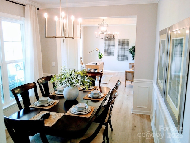 1141 Overlake Dr, Belmont, NC 28012 - dining area featuring a chandelier, light wood finished floors, and ornamental molding