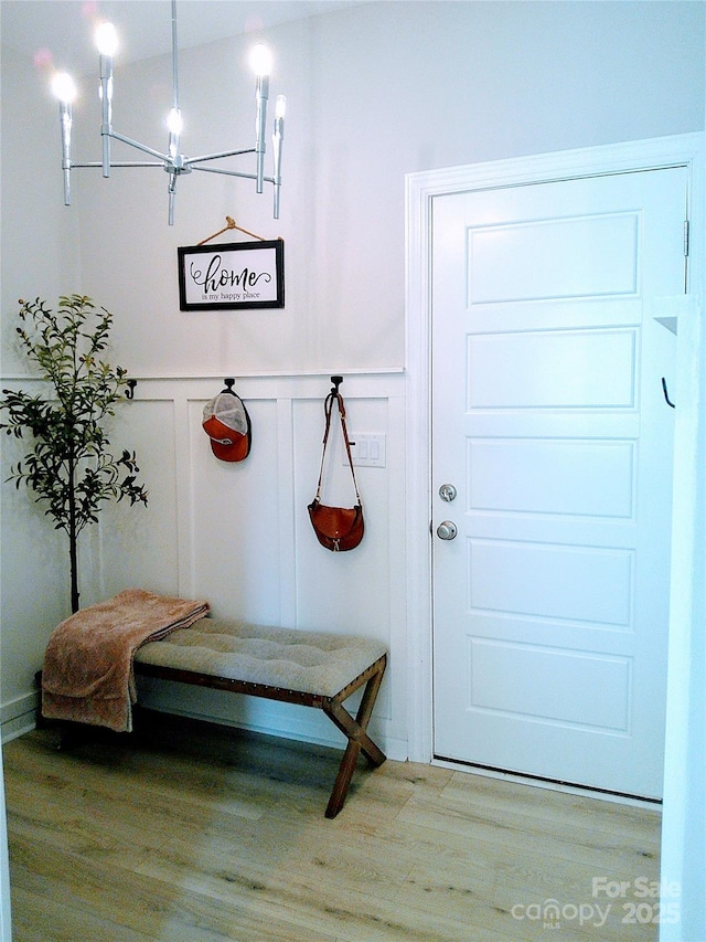 1141 Overlake Dr, Belmont, NC 28012 - mudroom with a decorative wall, wood finished floors, a chandelier, and wainscoting