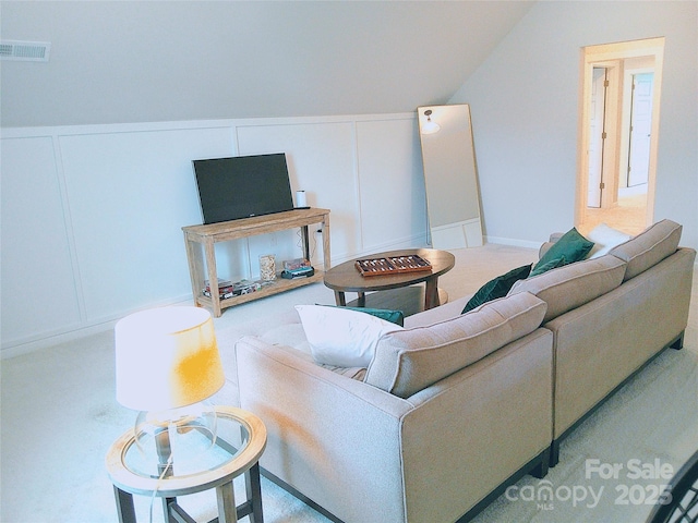 1141 Overlake Dr, Belmont, NC 28012 - living room with a decorative wall, lofted ceiling, and carpet floors