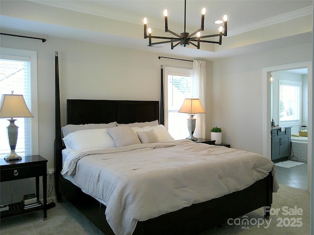 1141 Overlake Dr, Belmont, NC 28012 - bedroom featuring ornamental molding, a chandelier, connected bathroom, light colored carpet, and light tile patterned floors