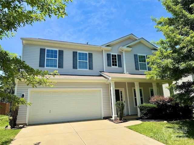 11109 Pond Valley Ct, Charlotte, NC 28269 - traditional home featuring concrete driveway, a porch, and an attached garage