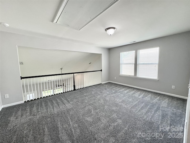 11109 Pond Valley Ct, Charlotte, NC 28269 - spare room featuring attic access, dark carpet, and a smoke detector