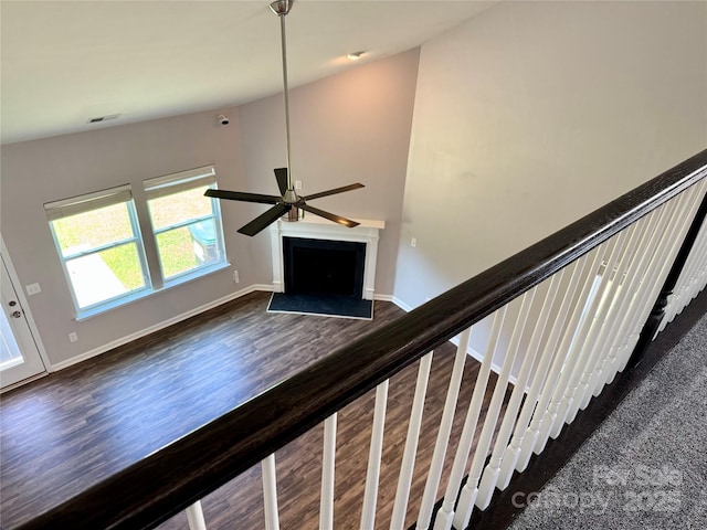 11109 Pond Valley Ct, Charlotte, NC 28269 - staircase featuring a ceiling fan, a fireplace with flush hearth, and wood finished floors
