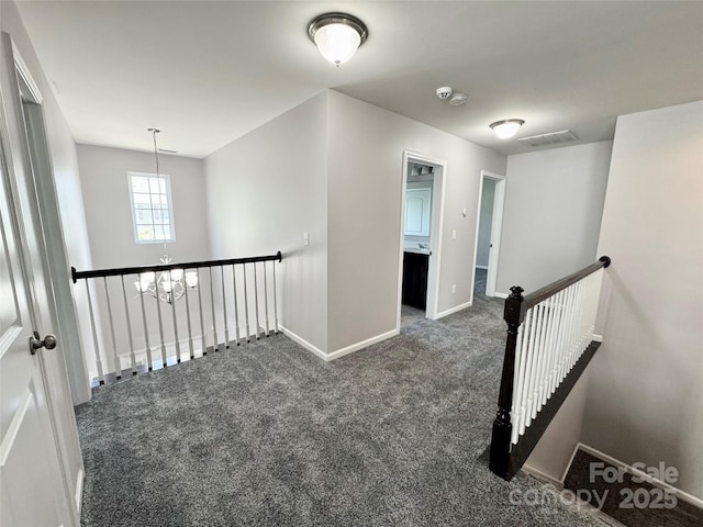 11109 Pond Valley Ct, Charlotte, NC 28269 - hallway with an upstairs landing, carpet flooring, and a chandelier