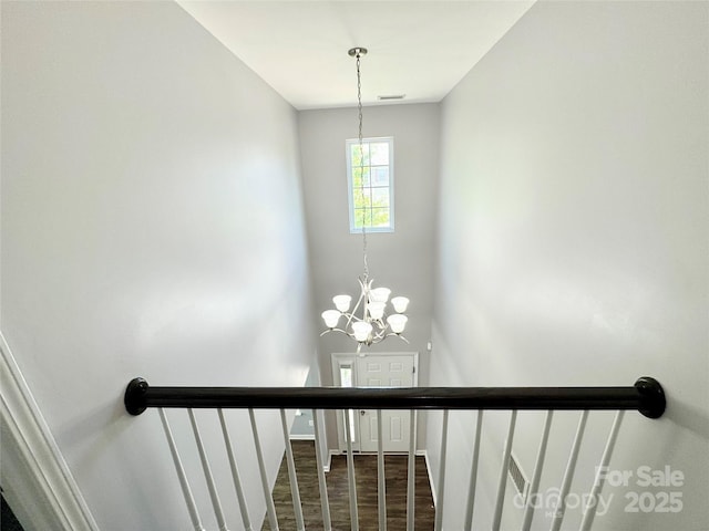11109 Pond Valley Ct, Charlotte, NC 28269 - stairs with a chandelier and baseboards