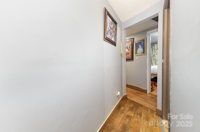 8301 Pine Oak Rd, Waxhaw, NC 28173 - corridor with wood finished floors and baseboards