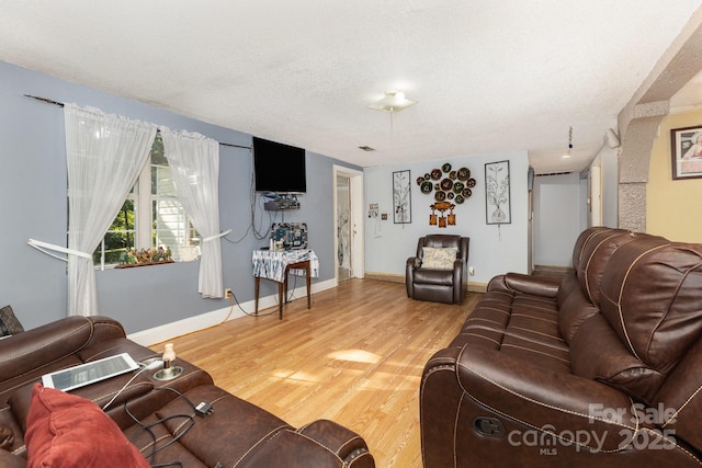 8301 Pine Oak Rd, Waxhaw, NC 28173 - living room with light wood-style flooring and a textured ceiling