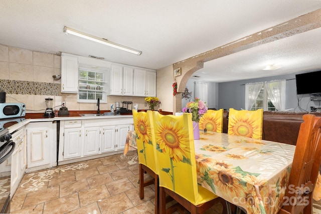 8301 Pine Oak Rd, Waxhaw, NC 28173 - dining space featuring healthy amount of natural light and arched walkways