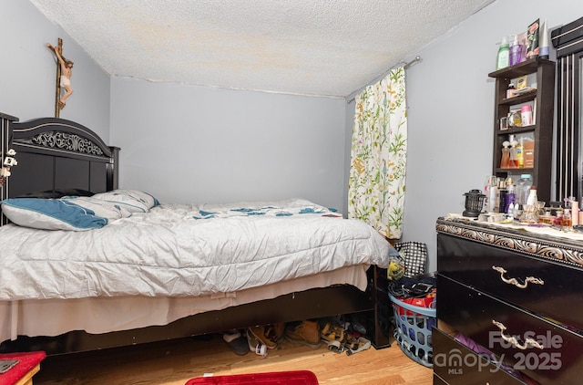 8301 Pine Oak Rd, Waxhaw, NC 28173 - bedroom with wood finished floors and a textured ceiling