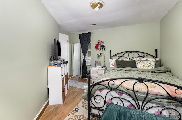 8301 Pine Oak Rd, Waxhaw, NC 28173 - bedroom featuring light wood-type flooring and baseboards