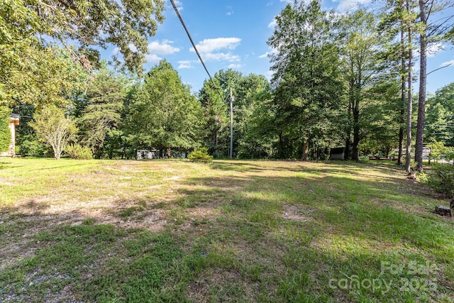 8301 Pine Oak Rd, Waxhaw, NC 28173 - view of green lawn with a view of trees