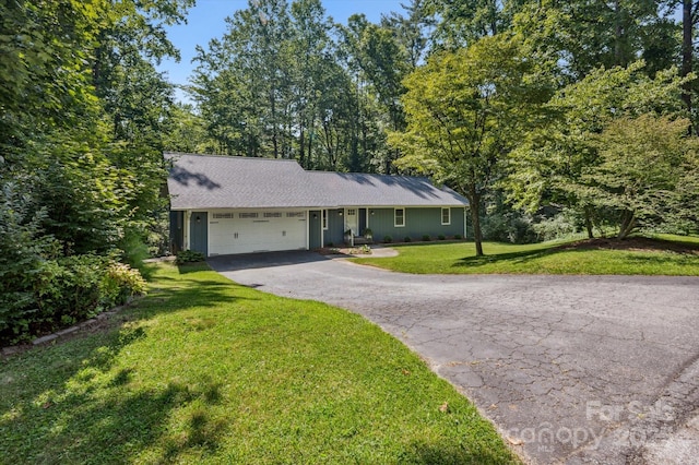104 Britton Ave, Hendersonville, NC 28791 - view of front of property with asphalt driveway, an attached garage, and a front lawn