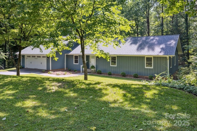 104 Britton Ave, Hendersonville, NC 28791 - view of front of property featuring an attached garage, roof with shingles, a front yard, board and batten siding, and concrete driveway