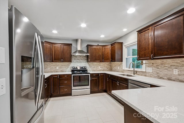 104 Britton Ave, Hendersonville, NC 28791 - kitchen with appliances with stainless steel finishes, wall chimney range hood, dark brown cabinets, tasteful backsplash, and recessed lighting