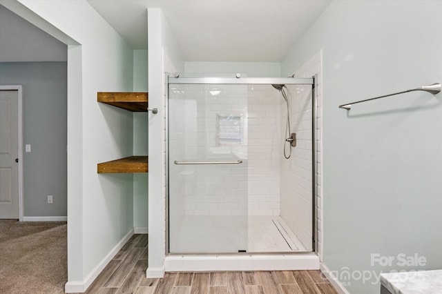 104 Britton Ave, Hendersonville, NC 28791 - full bath with a shower stall and wood finished floors