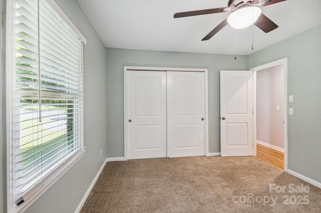 104 Britton Ave, Hendersonville, NC 28791 - unfurnished bedroom featuring carpet flooring, a closet, and a ceiling fan