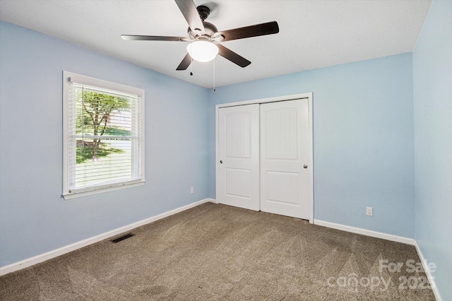 104 Britton Ave, Hendersonville, NC 28791 - unfurnished bedroom featuring carpet floors, a closet, and ceiling fan