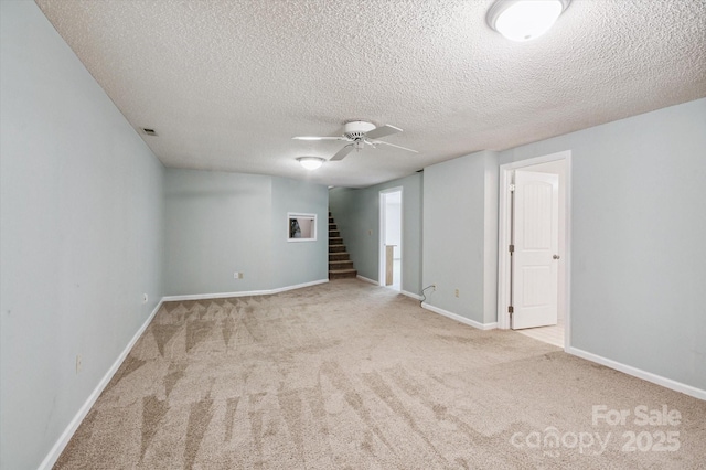 104 Britton Ave, Hendersonville, NC 28791 - finished basement with carpet, a textured ceiling, stairway, and a ceiling fan