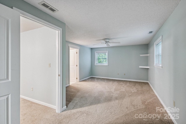 104 Britton Ave, Hendersonville, NC 28791 - spare room featuring carpet flooring, a ceiling fan, and a textured ceiling