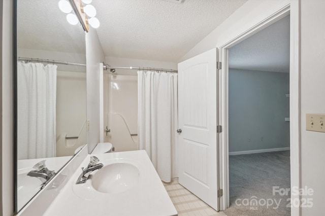 104 Britton Ave, Hendersonville, NC 28791 - bathroom with a textured ceiling, vanity, and a shower with shower curtain