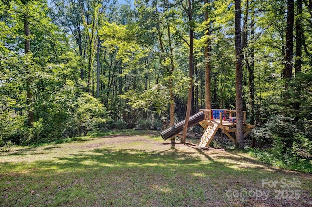 104 Britton Ave, Hendersonville, NC 28791 - view of green lawn with a wooded view