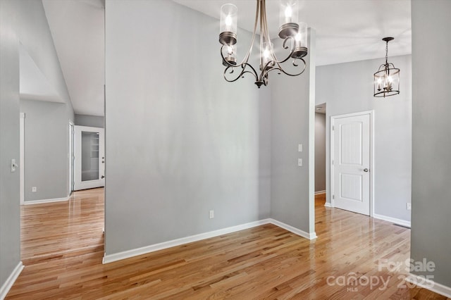 104 Britton Ave, Hendersonville, NC 28791 - unfurnished dining area with a chandelier and light wood finished floors