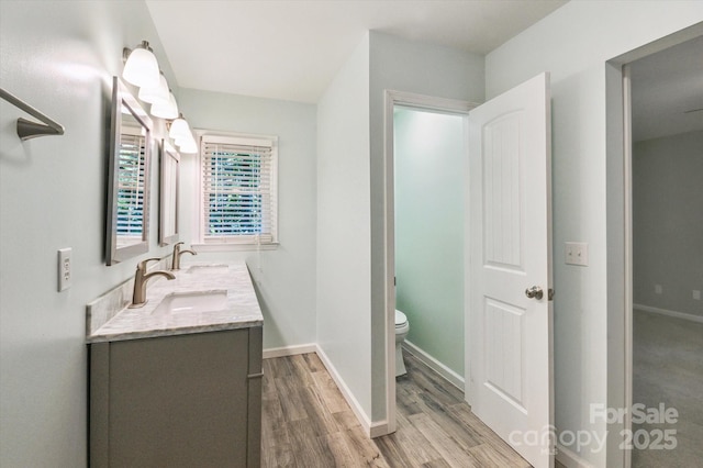 104 Britton Ave, Hendersonville, NC 28791 - bathroom featuring double vanity and wood finished floors