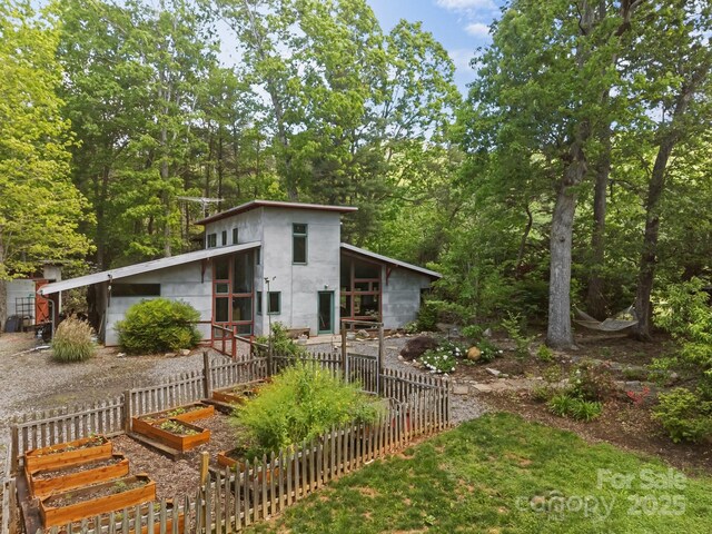 27 Rosebud Ln, Fairview, NC 28730 - view of front facade featuring a vegetable garden
