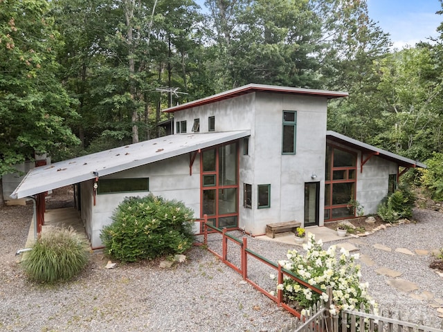 27 Rosebud Ln, Fairview, NC 28730 - view of side of property with a carport and a sunroom