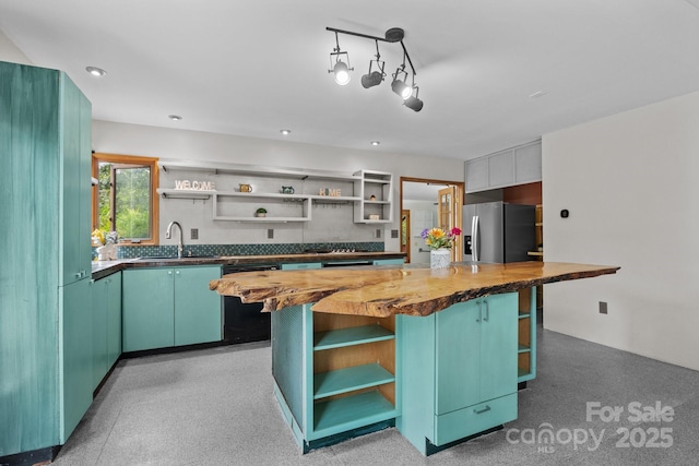 27 Rosebud Ln, Fairview, NC 28730 - kitchen with open shelves, stainless steel fridge with ice dispenser, black dishwasher, wooden counters, and a kitchen island