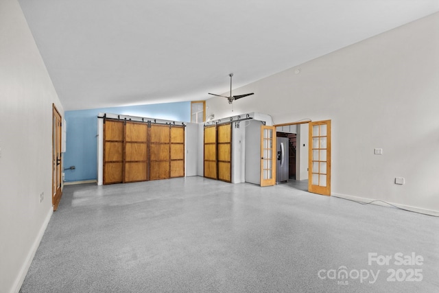27 Rosebud Ln, Fairview, NC 28730 - unfurnished living room featuring french doors, dark speckled floor, ceiling fan, and high vaulted ceiling
