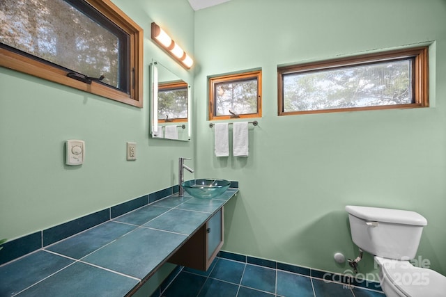 27 Rosebud Ln, Fairview, NC 28730 - bathroom with tile patterned floors, vanity, and healthy amount of natural light
