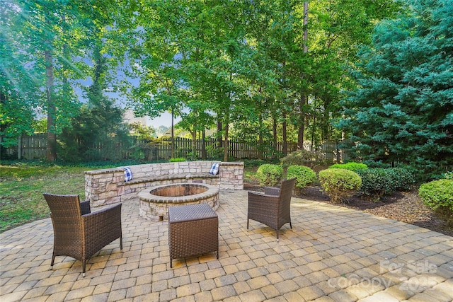 1237 Saint Johns Ave, Matthews, NC 28104 - fenced backyard featuring an outdoor fire pit and a patio