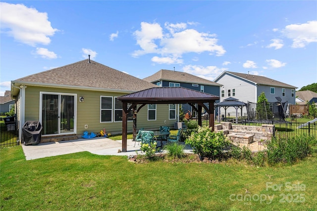 1009 Kemp Rd, Indian Trail, NC 28079 - back of property featuring a gazebo, a patio, and a shingled roof
