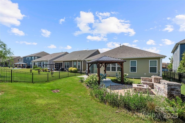 1009 Kemp Rd, Indian Trail, NC 28079 - back of house with a gazebo, a patio area, a fenced backyard, a residential view, and roof with shingles