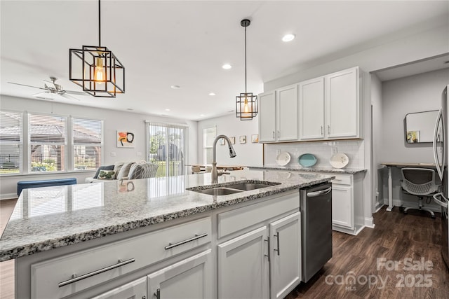 1009 Kemp Rd, Indian Trail, NC 28079 - kitchen featuring stainless steel dishwasher, ceiling fan, dark wood-style floors, white cabinets, and recessed lighting