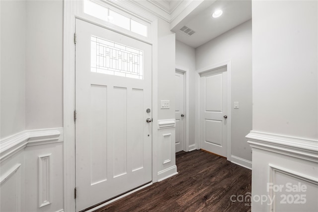 1009 Kemp Rd, Indian Trail, NC 28079 - entryway with dark wood finished floors and a wainscoted wall