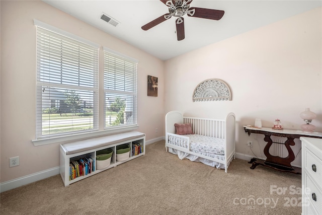 1009 Kemp Rd, Indian Trail, NC 28079 - carpeted bedroom featuring multiple windows and ceiling fan