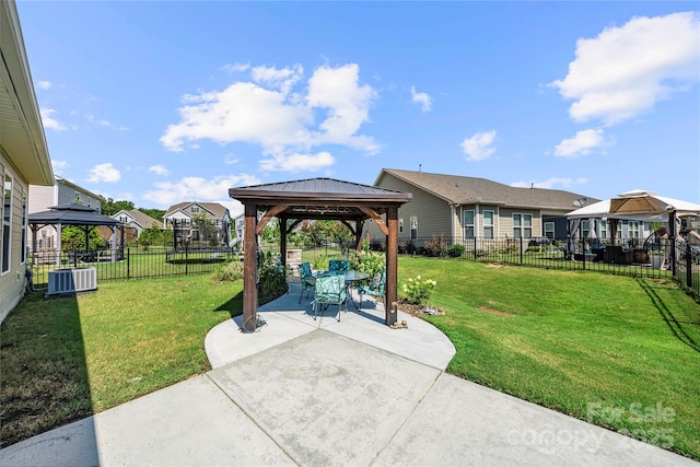 1009 Kemp Rd, Indian Trail, NC 28079 - fenced backyard featuring a gazebo, a patio, and a residential view