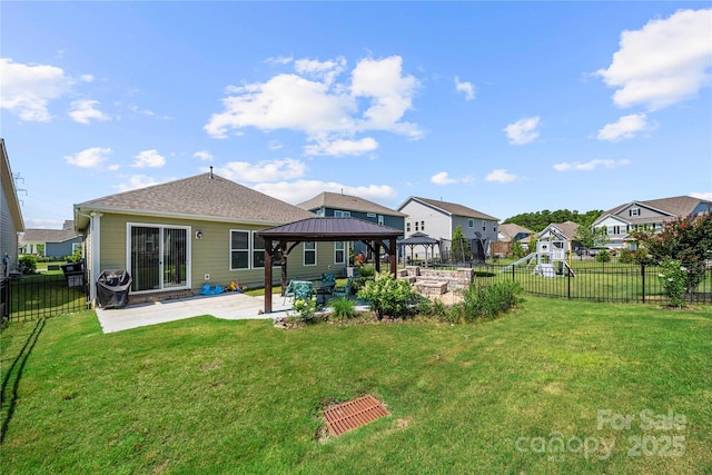 1009 Kemp Rd, Indian Trail, NC 28079 - back of property with a gazebo, a patio area, a fenced backyard, and a residential view