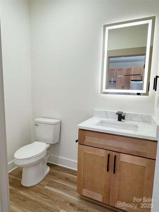 101 Bryan St, Kannapolis, NC 28083 - half bathroom featuring vanity and wood finished floors