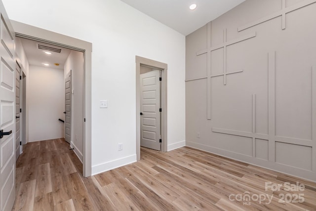 101 Bryan St, Kannapolis, NC 28083 - unfurnished bedroom with light wood-style flooring and recessed lighting