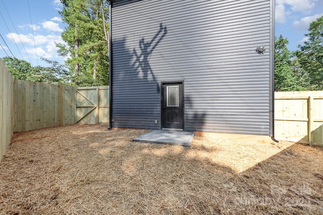 101 Bryan St, Kannapolis, NC 28083 - rear view of house with a fenced backyard and a gate