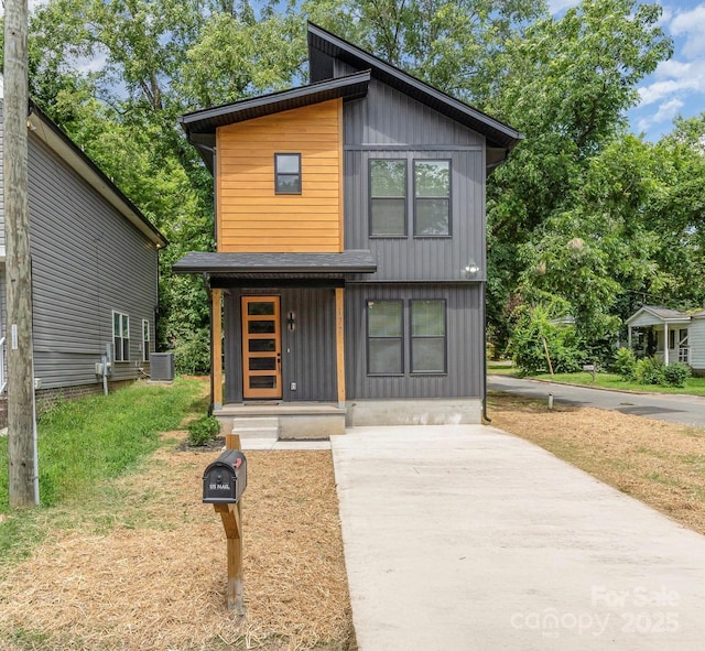 177 Georgia St SW, Concord, NC 28025 - modern home with driveway and board and batten siding