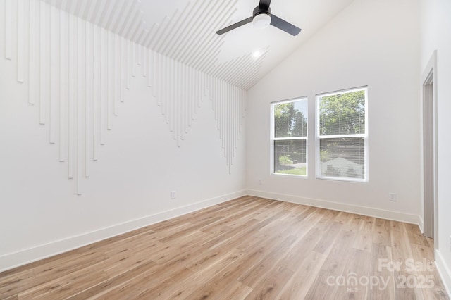 177 Georgia St SW, Concord, NC 28025 - spare room with light wood-style flooring, high vaulted ceiling, and ceiling fan