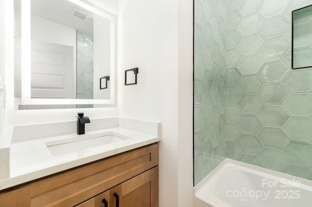 177 Georgia St SW, Concord, NC 28025 - bathroom featuring vanity and bathing tub / shower combination