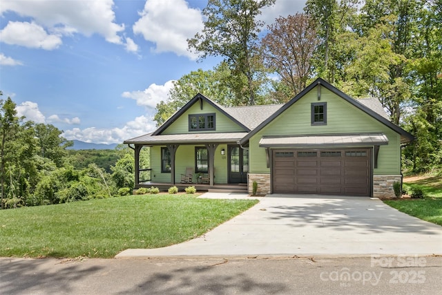 120 Gashes Creek Rd, Asheville, NC 28805 - craftsman-style home with covered porch, concrete driveway, a front yard, a garage, and a standing seam roof