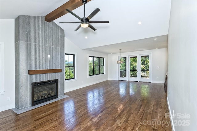 120 Gashes Creek Rd, Asheville, NC 28805 - unfurnished living room with a ceiling fan, beam ceiling, wood finished floors, a fireplace, and high vaulted ceiling
